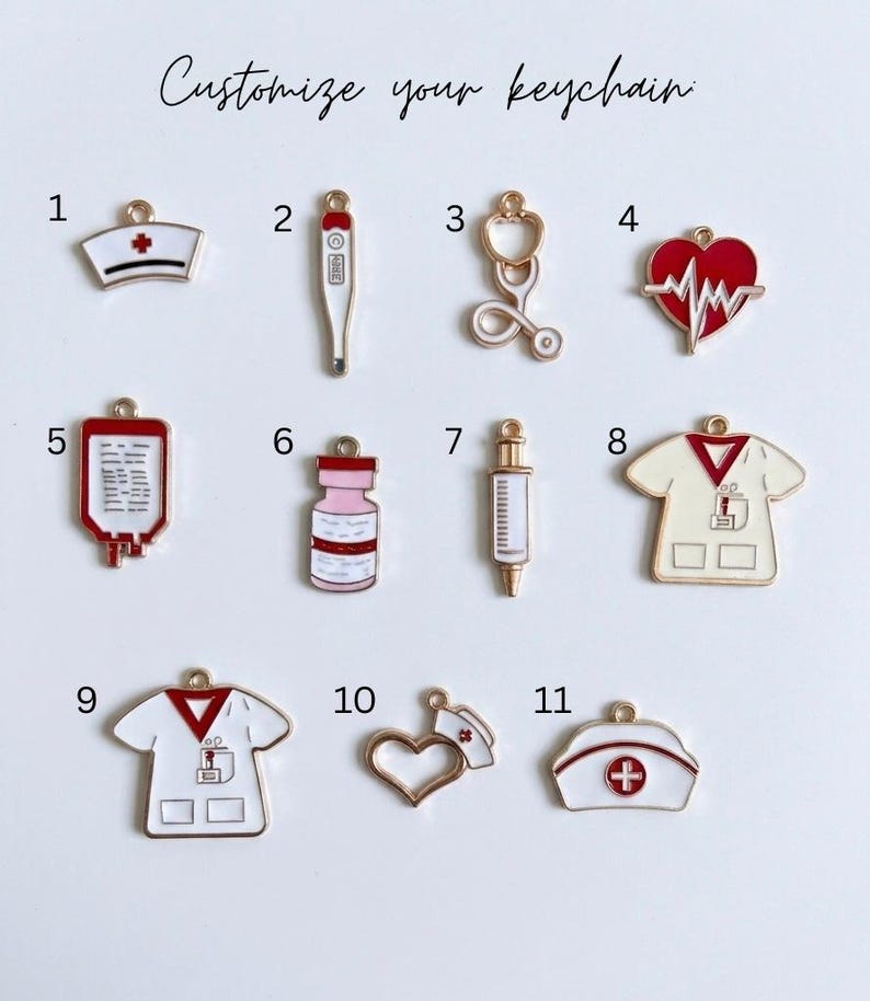 May include: A collection of eleven medical-themed metal charms for a keychain, labelled 1 through 11. The charms feature designs including a nurse cap, thermometer, stethoscope, heart with EKG line, blood bag, vial, syringe, and scrub tops.