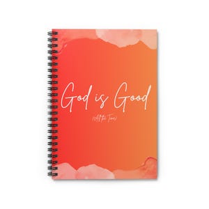 May include: A spiral-bound notebook featuring a vibrant orange and red gradient background with watercolour-style edges. The text "God is Good" is printed in a white script font, with the smaller text "(All the Time)" centred directly below it.