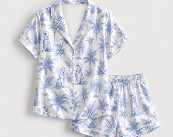 Pyjama van satijn met toile-print, loungewearcollectie met schattig honden- en palmenpatroon, top en broek.