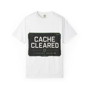 May include: White t-shirt with a black and green graphic that reads "CACHE CLEARED" in white block letters. Below the text is a green refresh symbol and the words "SYSTEM READY". The shirt has a crew neck and short sleeves.