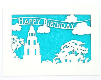 Happy Birthday banner flying over Balboa Park in San Diego, laser cut greeting card