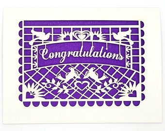 Congratulations flying in the wind, a Papel Picado flag, laser cut card, doves, hearts and made with love
