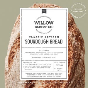 May include: A rectangular white product label for Willow Bakery Co. Classic Artisan Sourdough Bread, featuring black text, ingredient list, freshness tips, and a net weight of 1190 g, centred over a textured, golden-brown loaf of crusty bread.