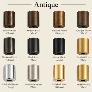 May include: A collection of twelve cylindrical metal hardware components arranged in a grid, labelled with finishes including Antique Brass, Antique Patina, Blackened Brass, Black Brass, Matte Black, Brushed Brass, Polished Chrome, and Polished Brass.