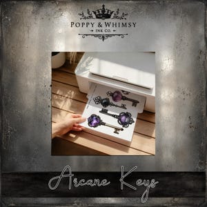 A home printer mockup showing the printable Arcane Keys fantasy ephemera sheet printing out on cardstock for a junk journal project.