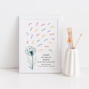 May include: A white framed print featuring a green dandelion illustration with seeds floating upwards as colourful names. The text reads: LEHRER s&auml;en Samen des WISSENS, die ein Leben lang wachsen. DANKE FRAU KREH! St. Anne Schule, Klasse 3, 2023/2024.