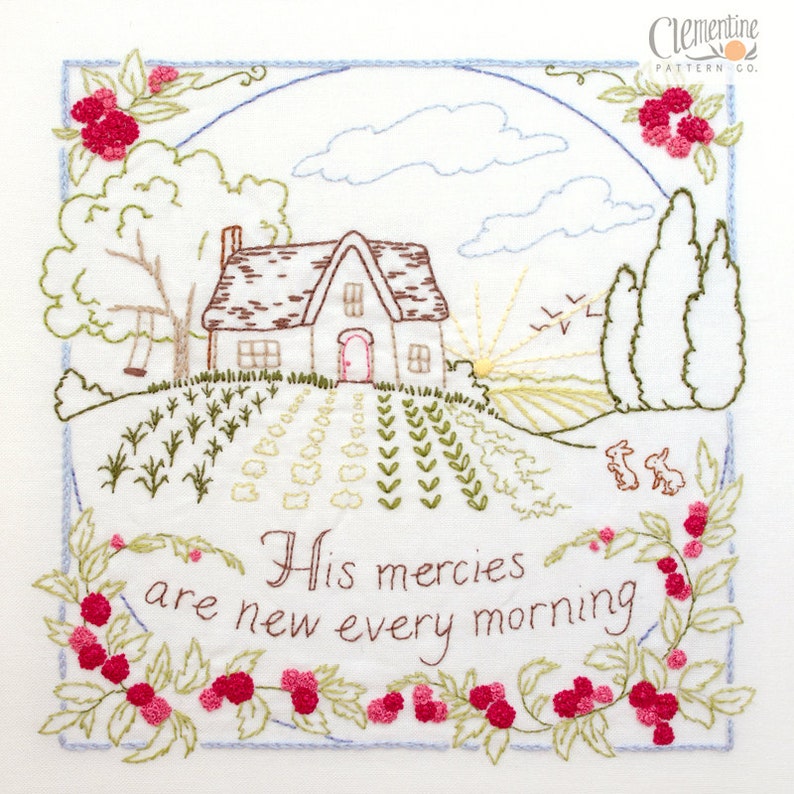 May include: Embroidered design featuring a cottage with a brown roof, a swing set, and a garden. The sun is rising in the background. The text "His mercies are new every morning" is embroidered below the cottage.