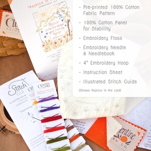 May include: A craft kit for embroidery featuring a pre-printed 100% cotton fabric pattern with the text "Rejoice in the Lord" and a colourful assortment of embroidery floss. The kit includes a 4-inch embroidery hoop, needle, needlebook, instruction sheet, and illustrated stitch guide.