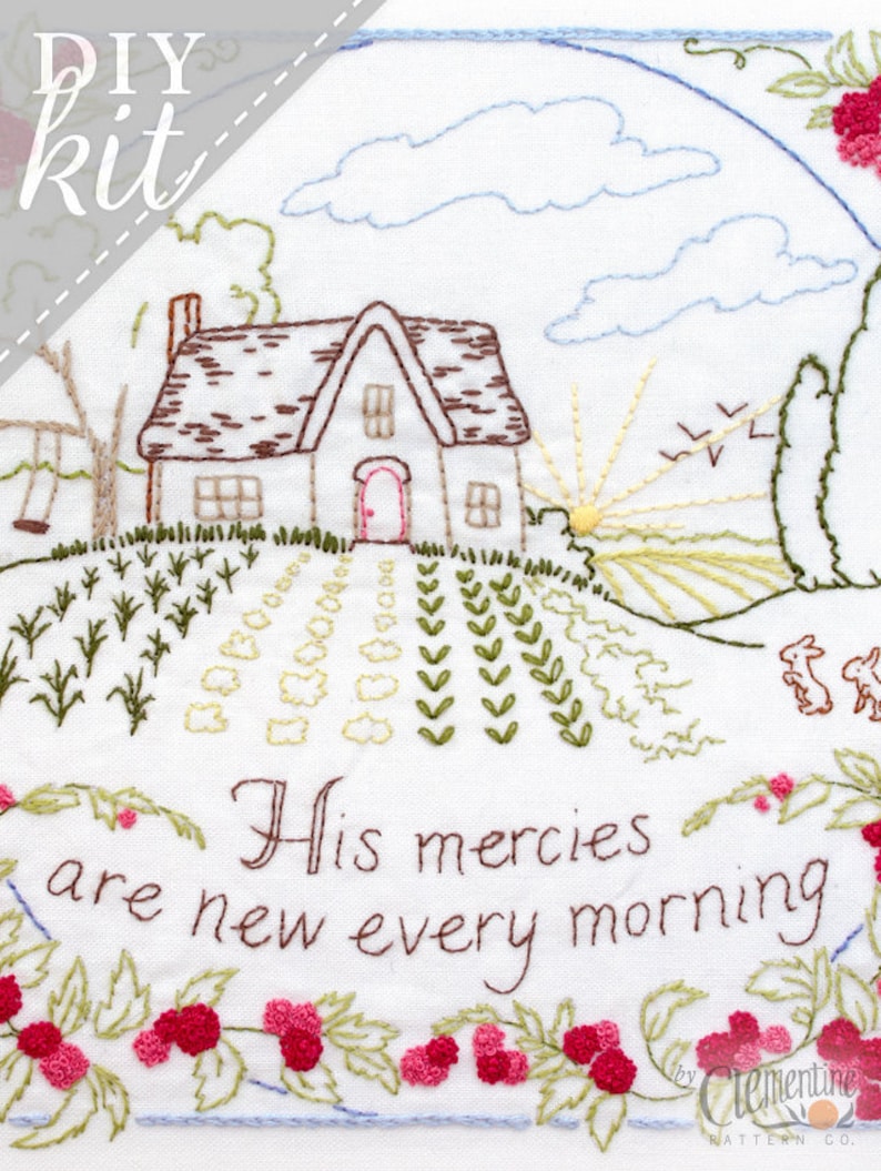May include: DIY embroidery kit featuring a cottage with a red door, a swing set, and a sunrise. The text "His mercies are new every morning" is embroidered below the cottage. The kit is by Clementine Pattern Co.