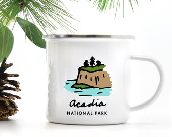 May include: White enamel camping mug with a black and brown illustration of a rocky island with trees and the text "Acadia National Park".