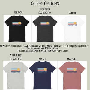May include: A selection of t-shirts in various colors, including black, dark gray, white, athletic heather, navy, and mauve. Each shirt features a horizontal design with stripes, a sun, and the text "Sebago Lake."