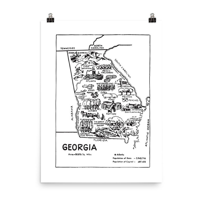 May include: A black and white line drawing of the state of Georgia, with various agricultural products and natural resources depicted within its borders. The text "GEORGIA" is at the bottom of the map, along with the area and population of the state.
