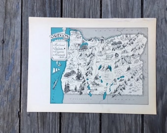 Könnte beinhalten: Eine Vintage-Karte von Oregon, illustriert in Schwarzweiß mit einem türkisfarbenen Rand. Die Karte enthält Städte wie Portland, Salem, Eugene und Klamath Falls.