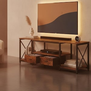 May include: A rectangular media console featuring a dark brown wood-grain finish and a black metal frame with X-shaped side supports. The unit includes two central drawers, open shelving for electronics, and a flat top surface for a television.