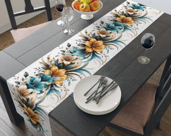 Camino de mesa con borde floral en tonos verde azulado y dorado / Algodón y poliéster