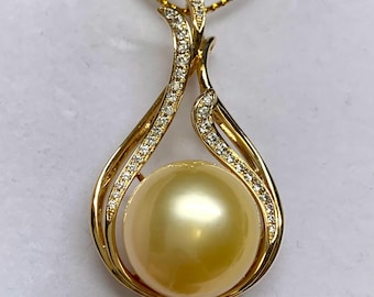 May include: A gold pendant necklace with a large golden pearl surrounded by a diamond-encrusted setting.