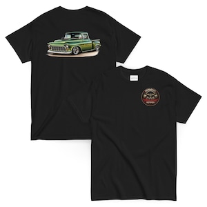 May include: Black t-shirts featuring a classic green pickup truck graphic on the back and a circular logo with text on the front. The truck graphic is detailed with a vintage aesthetic, showcasing a green body and chrome accents.