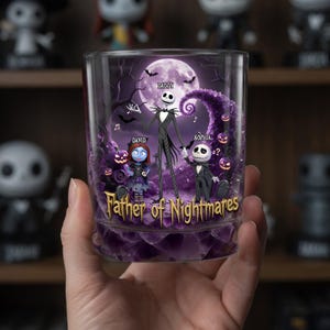 May include: A clear glass tumbler featuring a design with Jack Skellington, Sally, and a child character, with the text "Father of Nightmares." The background includes a full moon, bats, and purple accents. The word "Daddy" is written above Jack's head.