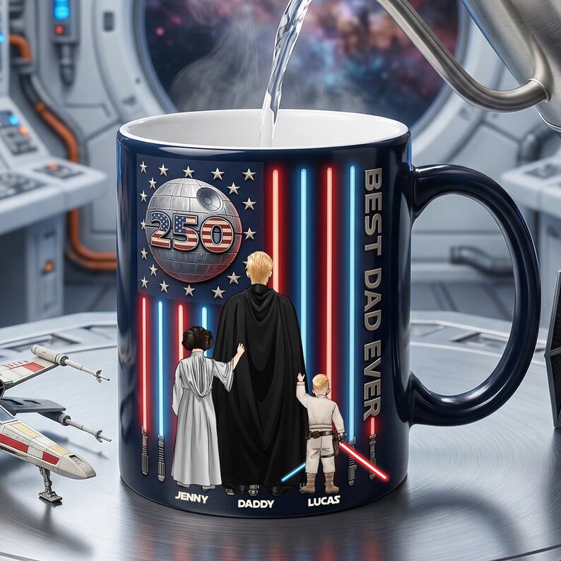 May include: A navy blue ceramic mug with a black handle features a Star Wars theme. The design includes a Death Star, red and blue lightsaber stripes, and the words "BEST DAD EVER." The mug has a family portrait with the names Jenny, Daddy, and Lucas.