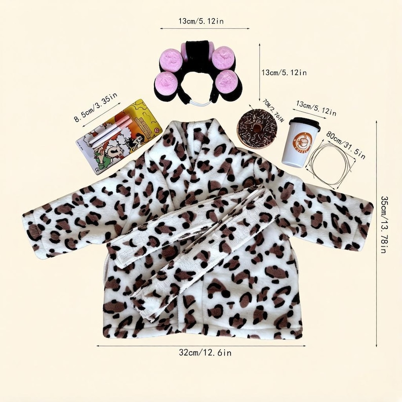 May include: A plush leopard print robe with a matching belt, a black headband with four pink hair rollers, a rectangular box with two pens, a chocolate donut, a white coffee cup with a brown logo, and a thin wire loop, all with labeled dimensions.