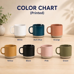May include: A color chart of ceramic mugs in various colors, including white, dark blue, orange, yellow, black, pink, and green. Each mug has a contrasting gray base and a curved handle. The text "COLOR CHART (Printed)" is at the top.