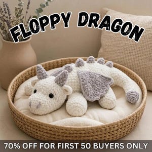 May include: A white and grey crocheted dragon plush toy with black eyes, textured wings, and a row of spikes along its back. The text FLOPPY DRAGON and 70% OFF FOR FIRST 50 BUYERS ONLY is visible in the image, which features a soft yarn construction.