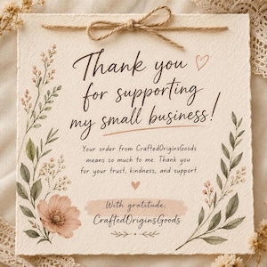 May include: A square, textured off-white card featuring a brown twine bow at the top. The text reads: Thank you for supporting my small business! Your order from CraftedOriginsGoods means so much to me. With gratitude, CraftedOriginsGoods. Floral art.