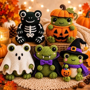 May include: Five crocheted frog figurines dressed for Halloween. One wears a skeleton suit, one sits inside a pumpkin, one wears a white ghost sheet, one is a vampire with a cape and bow tie, and one wears a witch hat and scarf holding a pumpkin bucket.
