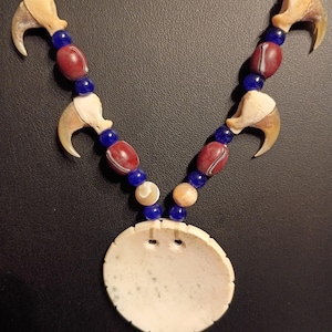 Ticked Shell Gorget accompanied with Bobcat Claws & Early 18th Century style Trade Beads