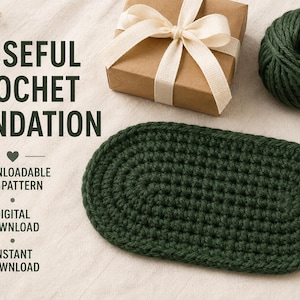 May include: A dark green oval crochet piece with a matching ball of yarn, a wooden crochet hook, and a brown gift box with a white ribbon. The text reads: A USEFUL CROCHET FOUNDATION, DOWNLOADABLE PDF PATTERN, DIGITAL DOWNLOAD, INSTANT DOWNLOAD.