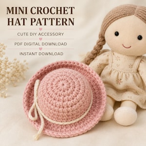 May include: A pink crochet hat with a cream-colored cord tied in a bow, displayed next to a fabric doll. The image includes the text: MINI CROCHET HAT PATTERN, CUTE DIY ACCESSORY, PDF DIGITAL DOWNLOAD, INSTANT DOWNLOAD. The hat has a round crown.