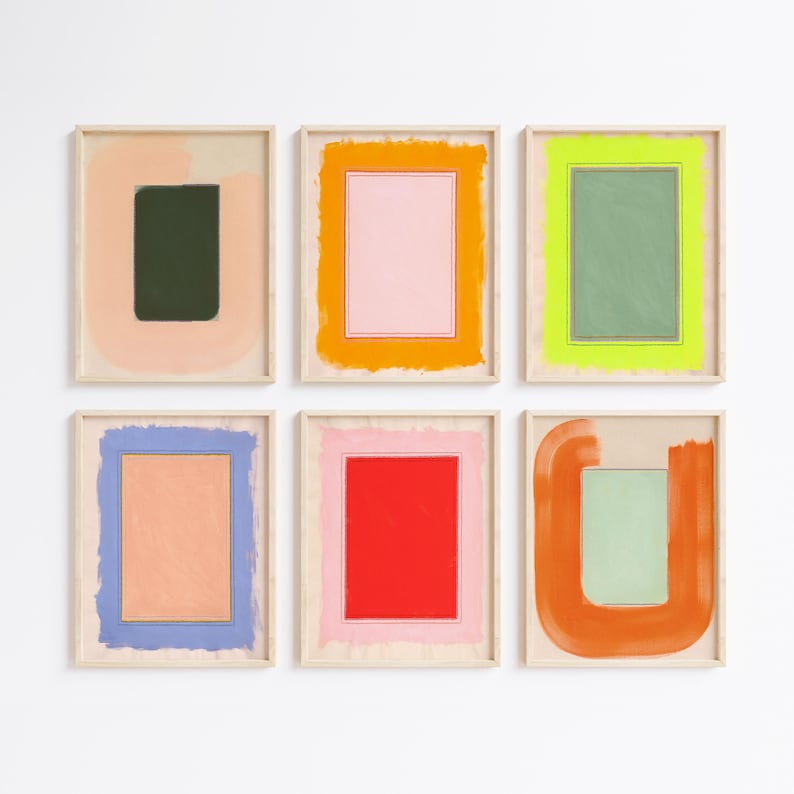 May include: Six framed abstract art prints. Each print features a rectangular or square shape in the center, surrounded by a contrasting color. The color palette includes pink, green, orange, blue, and red. The frames are a natural wood color.