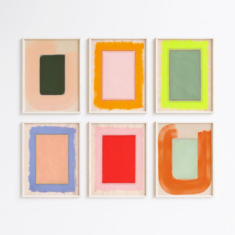 May include: Six framed abstract art prints. Each print features a rectangular or square shape in the center, surrounded by a contrasting color. The color palette includes pink, green, orange, blue, and red, with a neutral background.
