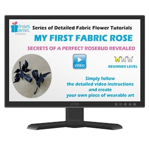 May include: A computer monitor shows a tutorial titled "MY FIRST FABRIC ROSE" with the text "Secrets of a Perfect Rosebud Revealed." The screen displays a video button and a beginner level indicator. The image includes fabric rose examples.