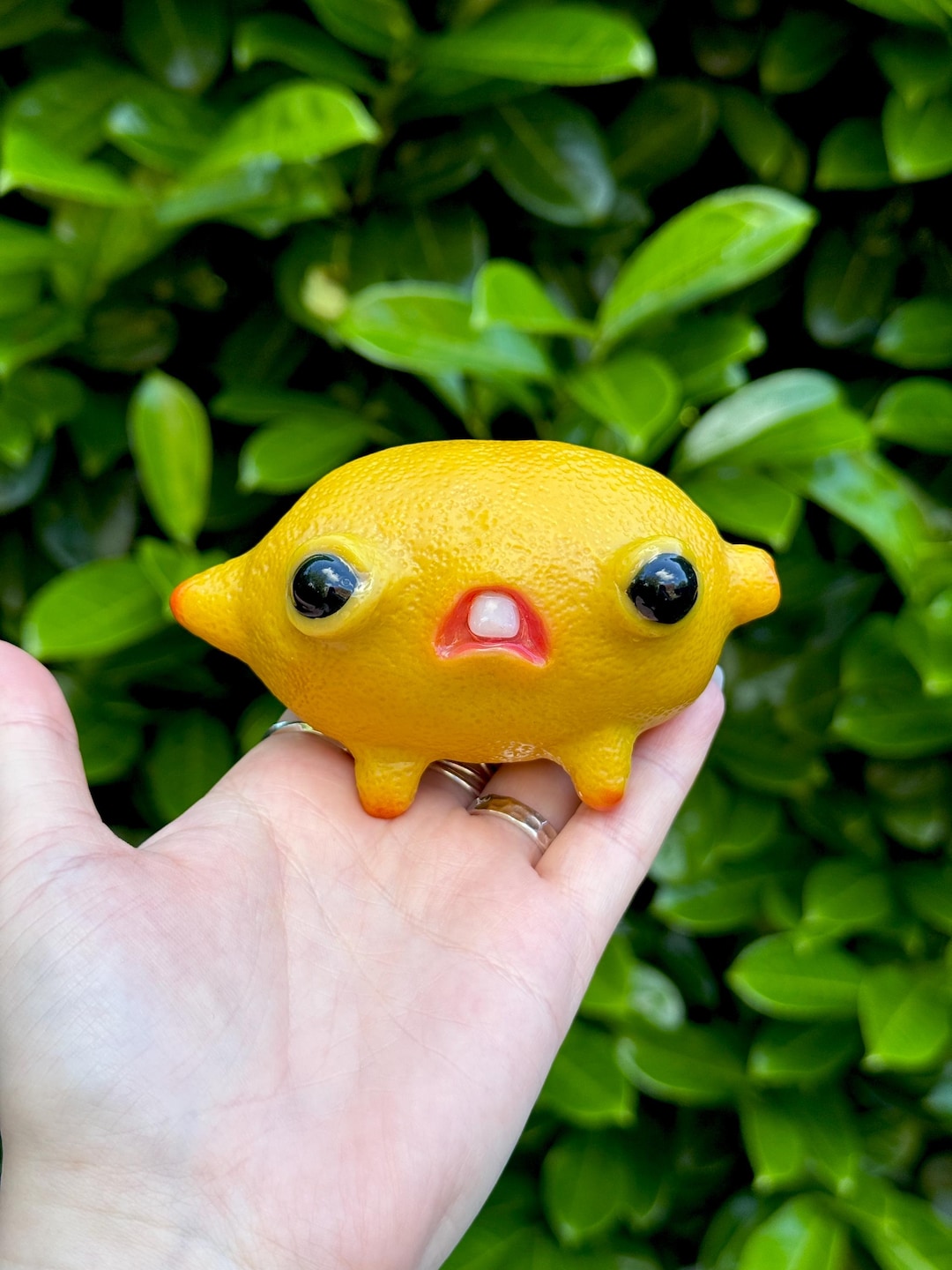Cursed lemon creature with bulging eyes