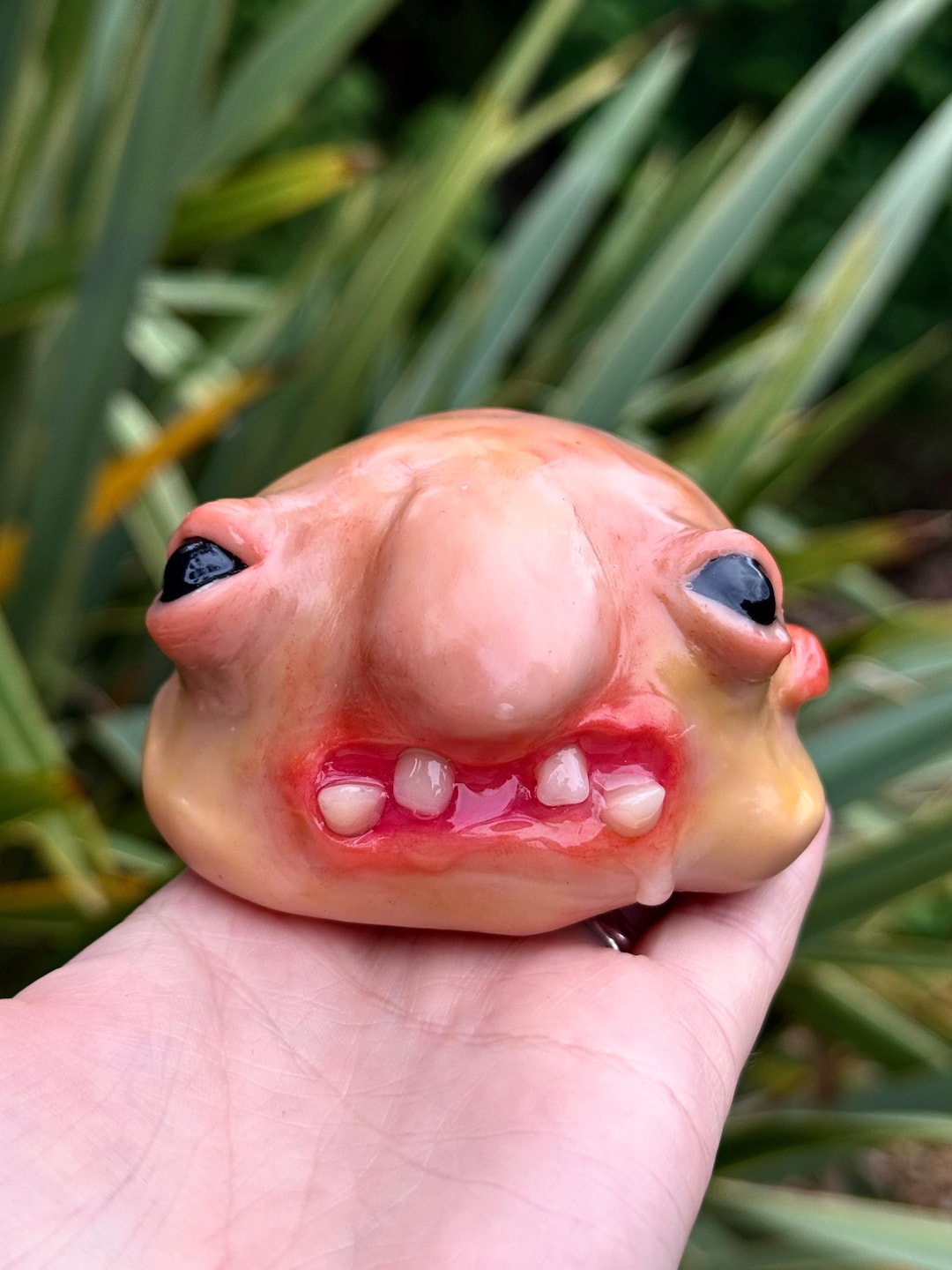 Cursed blobfish sculpture with a big nose