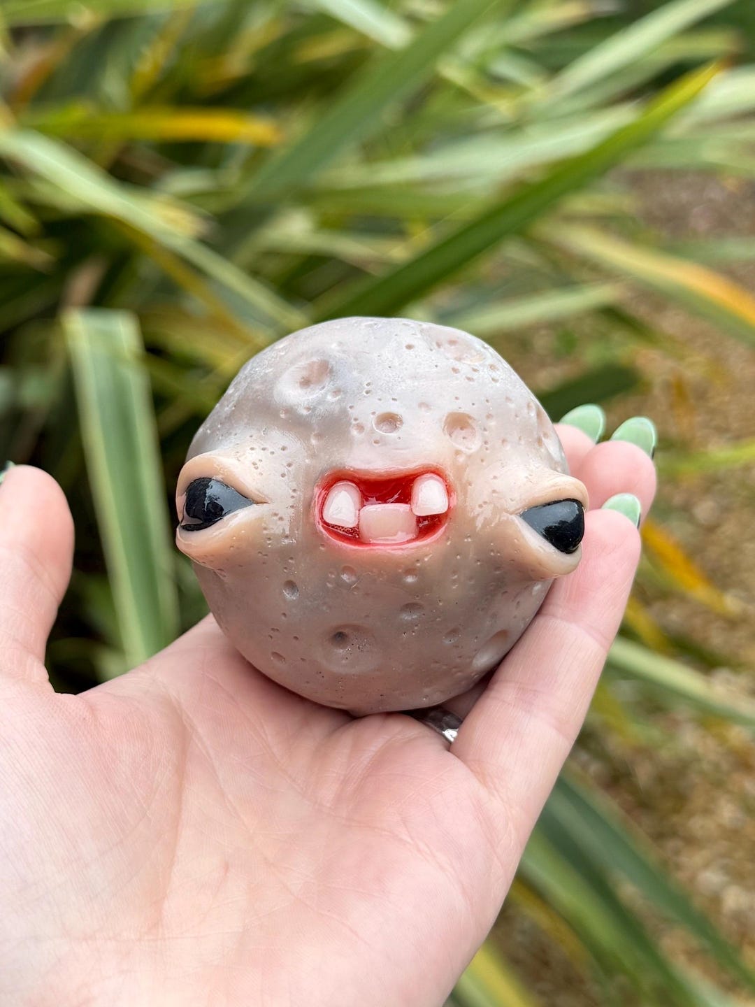 Cursed Moon Baby, a hand sculpted polymer clay moon creature