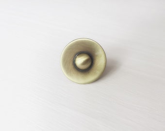 Round Cabinet Knob in Distressed Antique Brass