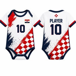 May include: A white baby bodysuit featuring a red and white checkered pattern, navy blue trim, and the number 10. The front displays the Croatian flag, while the back shows the text PLAYER above the number 10, with red and navy blue brush strokes.