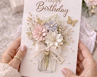 Tarjeta de cumpleaños con flores de papel en capas 3D, lazo de gasa y detalles de perlas, incluye sobre.