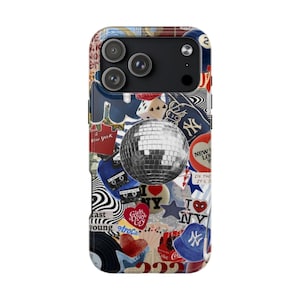 May include: A phone case with a collage design featuring a disco ball, dice, and various New York-themed stickers. The case has a glossy finish and a pop socket. The design includes the text "New York" and "Girls Don't Cry".