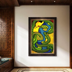 May include: A framed rectangular wall art piece featuring a stylized illustration of a yellow-skinned figure embraced by a large, textured green snake. The composition uses bold black outlines, vibrant blue accents, and a golden yellow background.
