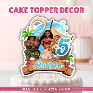 May include: A cake topper featuring Moana, Maui, Pua, and Heihei with a large blue number 5 and the name Andrea written in script on a wooden sign. The design includes a sail, palm trees, and hibiscus flowers against a blue water background.