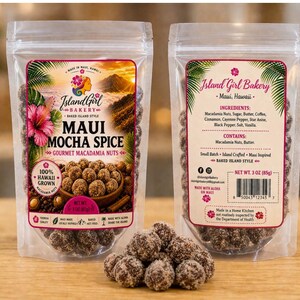 May include: Two clear plastic bags of Maui Mocha Spice gourmet macadamia nuts. The bags have colorful labels with text and images of nuts, flowers, and a mountain scene. The text reads "Island Girl Bakery" and "100% Hawaii Grown."