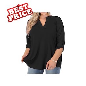 May include: A solid black blouse featuring a notched V-neckline and three-quarter length sleeves with roll-tab details. The garment has a relaxed, flowy fit and is paired with light blue denim jeans, creating a simple and versatile top.