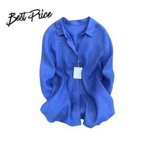 May include: A bright blue long-sleeve button-down shirt with a classic collar and a white rectangular tag attached to the front placket. The text "Best Price" is printed in black script in the upper left corner of the image.