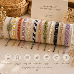 May include: A collection of twelve macrame bracelets displayed on a cylindrical holder. The bracelets feature various designs including flowers, hearts, stripes, and a star charm, crafted in colours like green, white, orange, purple, pink, and black.