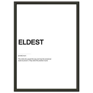 May include: A framed wall art print featuring the word ELDEST in bold black capital letters on a white background. Below the word is the phonetic pronunciation [el-did] noun, followed by the definition: The child who paved the way and has the emotional scars to prove it. They were the practice round.