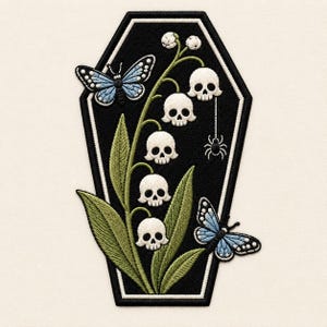 May include: An embroidered patch shaped like a black coffin with a white border. It features a central stem of lily-of-the-valley flowers with white skull-shaped blossoms, green leaves, two light blue butterflies, and a small black spider hanging.
