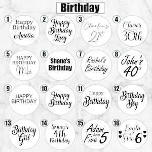 May include: A collection of sixteen circular white stickers featuring black text designs for birthdays. Each sticker displays unique typography and phrases such as Happy Birthday, names, and ages, numbered one through sixteen in black circles.